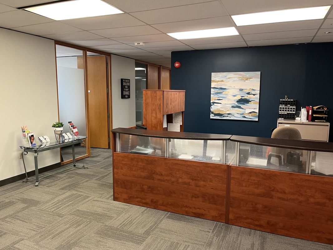 The reception desk and waiting area at the Burlington office