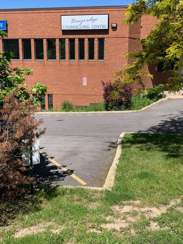 The Bayridge Counselling Centre sign on the brick front of the Hamilton office building