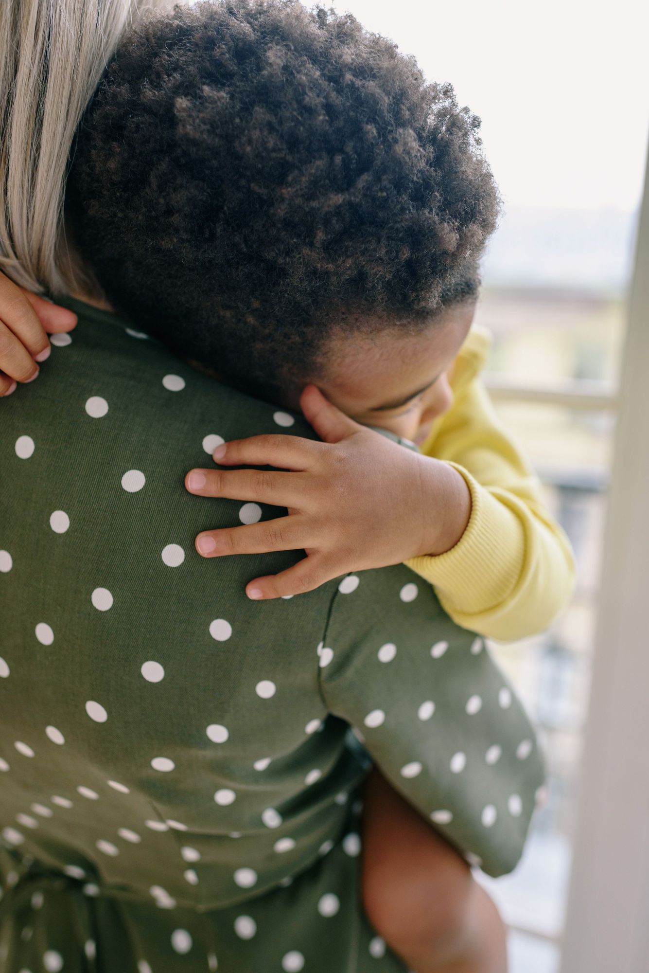 A child hugging a parent tightly